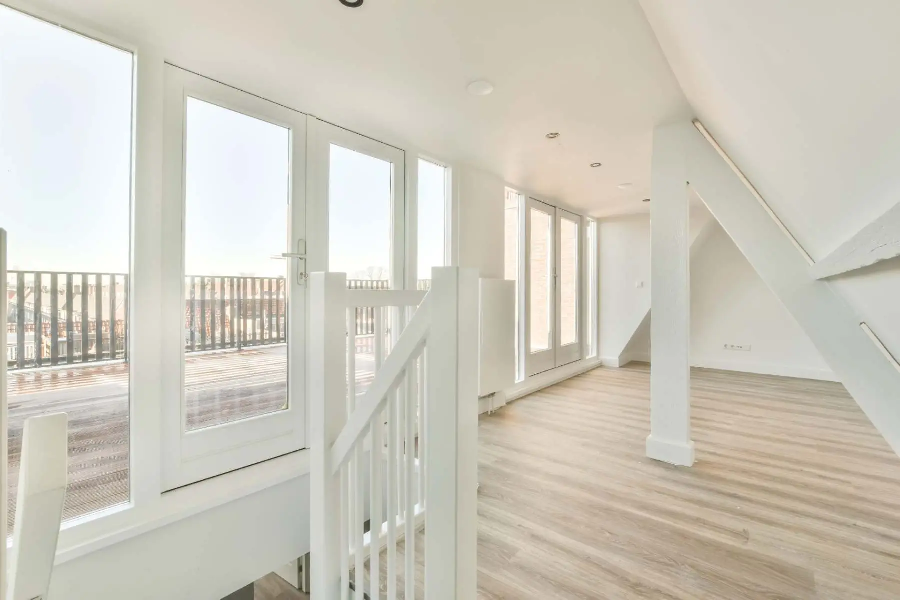 Empty room with new doors during an HMO conversion Welgo Builders Ltd Manchester