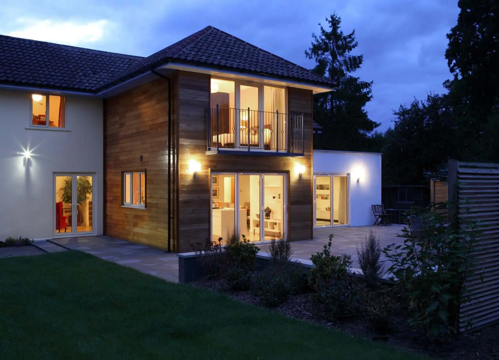 Extended property illuminated in the evening Welgo Builders Ltd Manchester